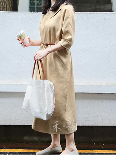 禾陶成衣女装品牌2021夏季简约风纯色长裙