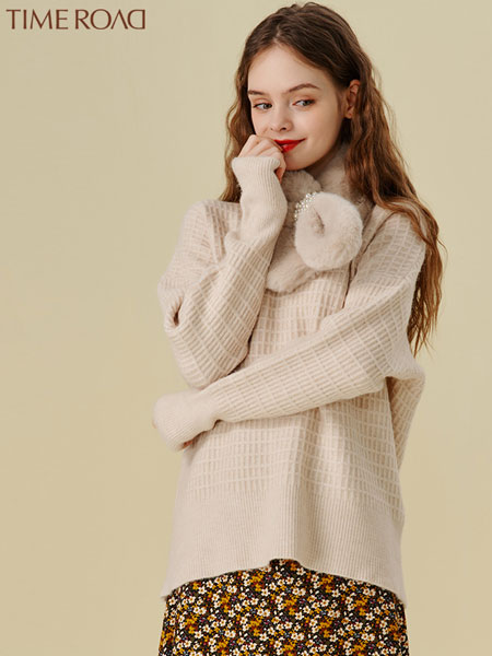 汤米诺女装品牌2021冬季气质柔软中长款毛衣