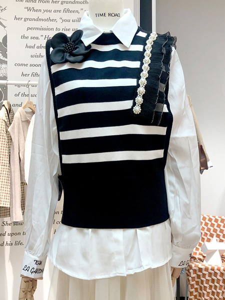 汤米诺女装品牌2022秋季条纹设计感拼接上衣